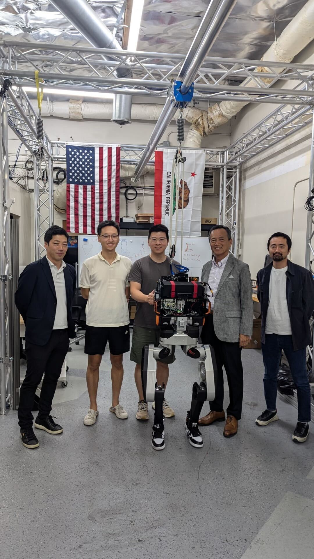 UCR team with Shimizu representatives and humanoid robot