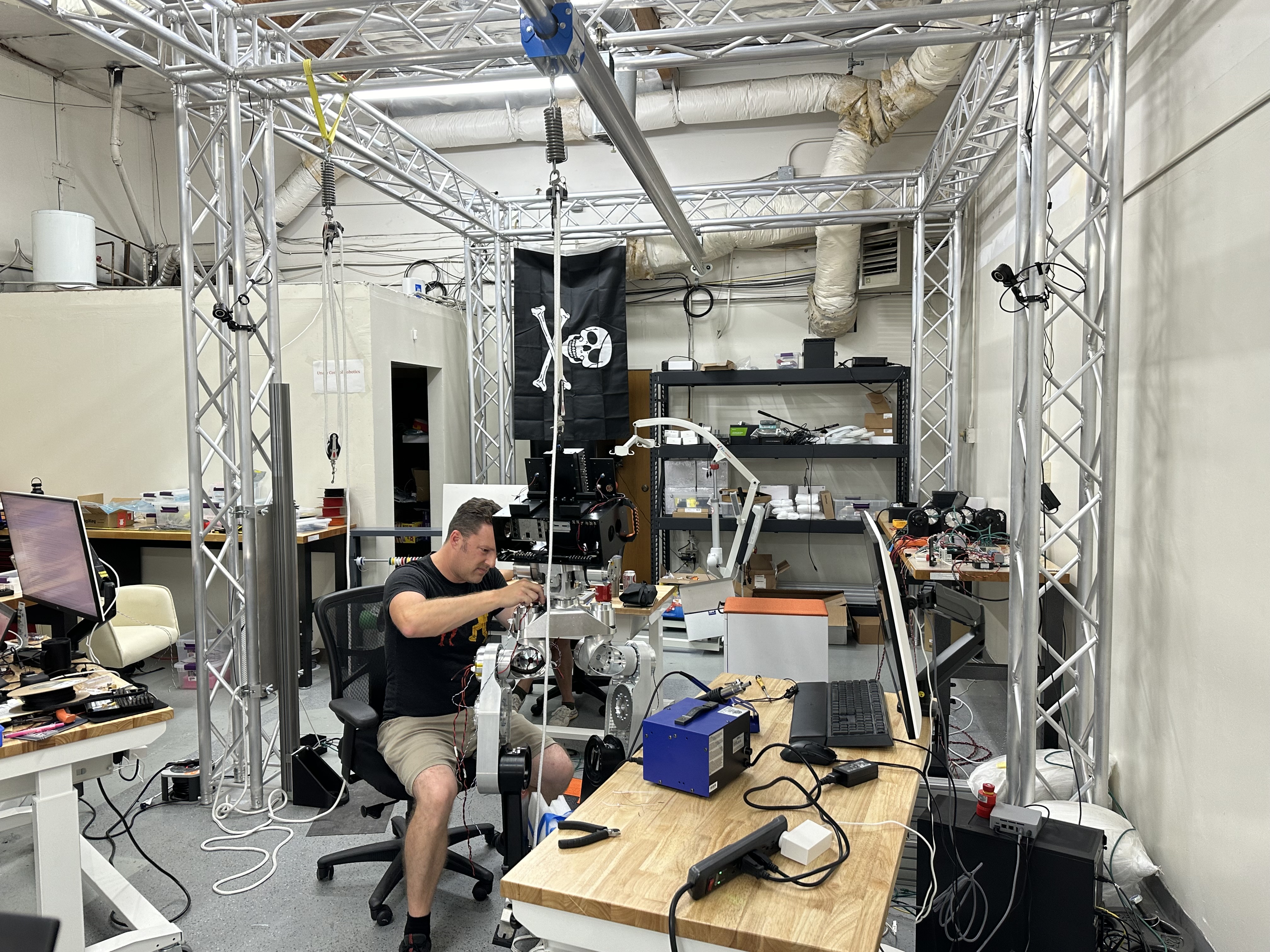 Engineer working on robot components in UCR development lab